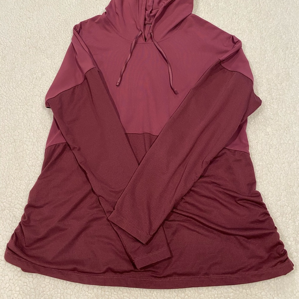 Fabletic’s maroon color hooded athletic top
